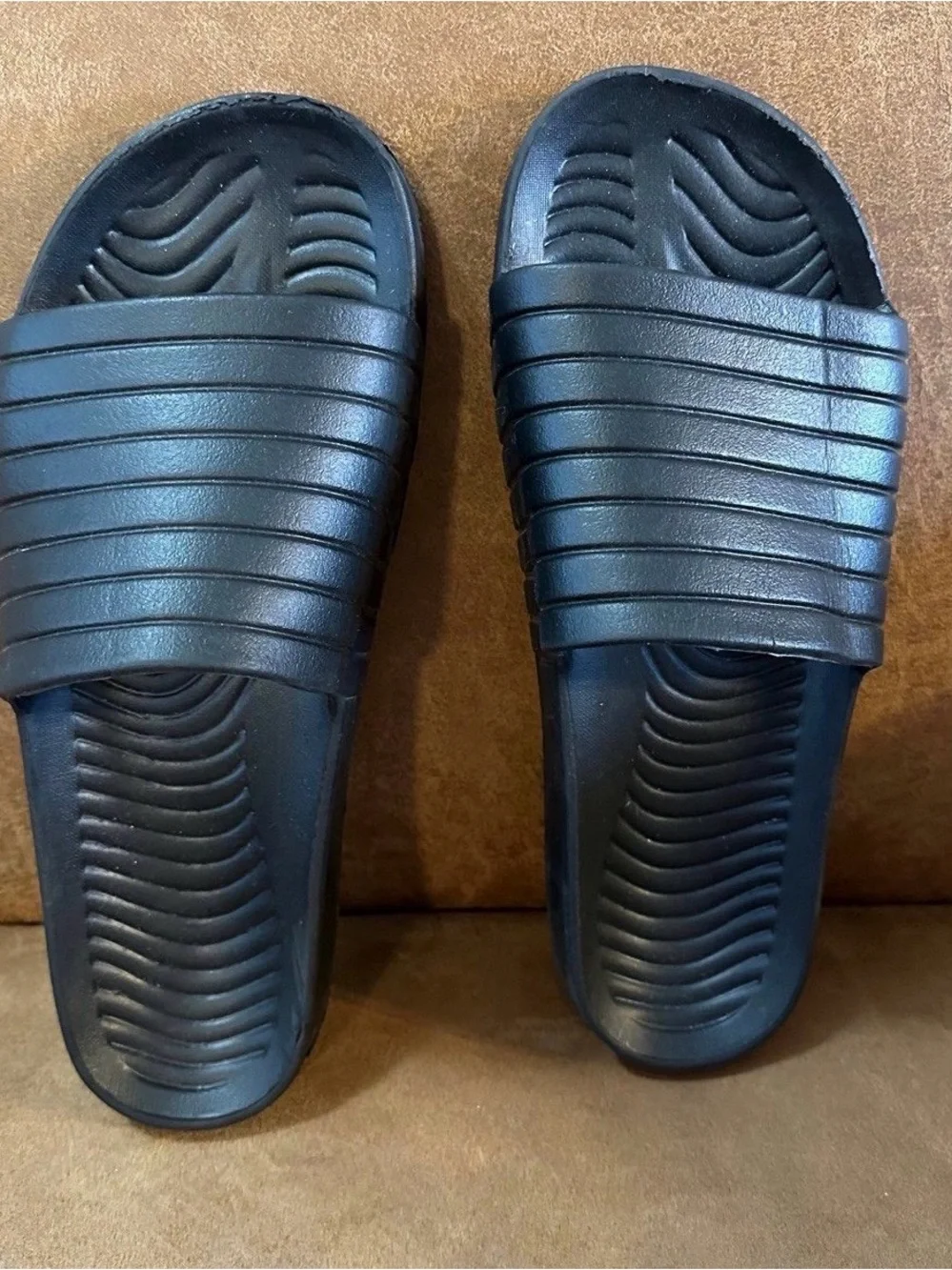 Black slides, men’s size 12, in good-worn once condition